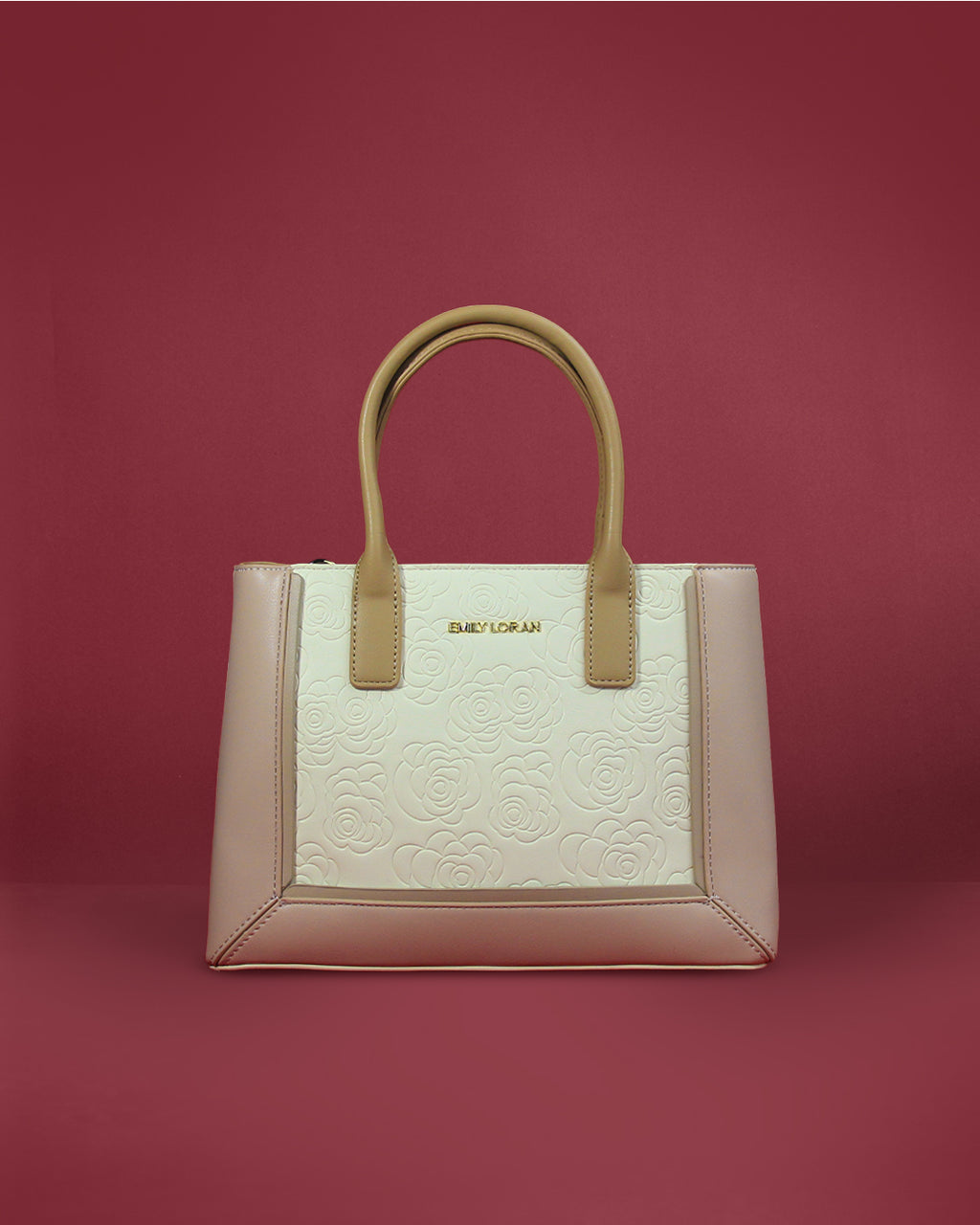 Structured square tote with camellia-embossed medallion, contrast border, and rolled handles — Emily Loran PH