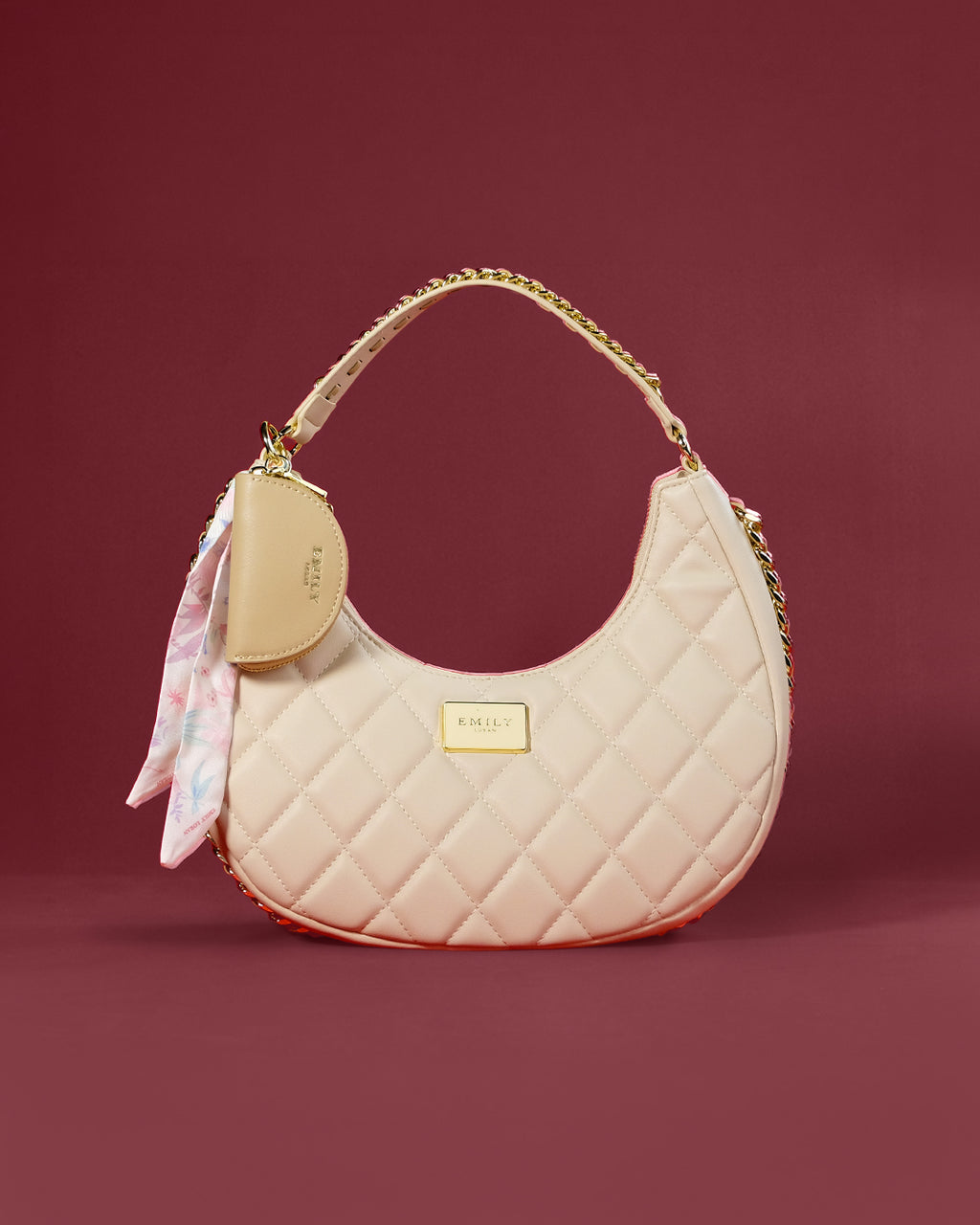 Diamond-quilted crescent hobo with chain-trimmed handle and coin-purse charm — Emily Loran PH