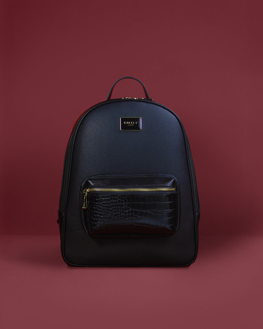 Structured saffiano-look backpack with glossy croc-emboss front pocket and gold plaque — Emily Loran PH